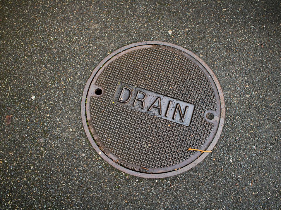 A round metal drain cover